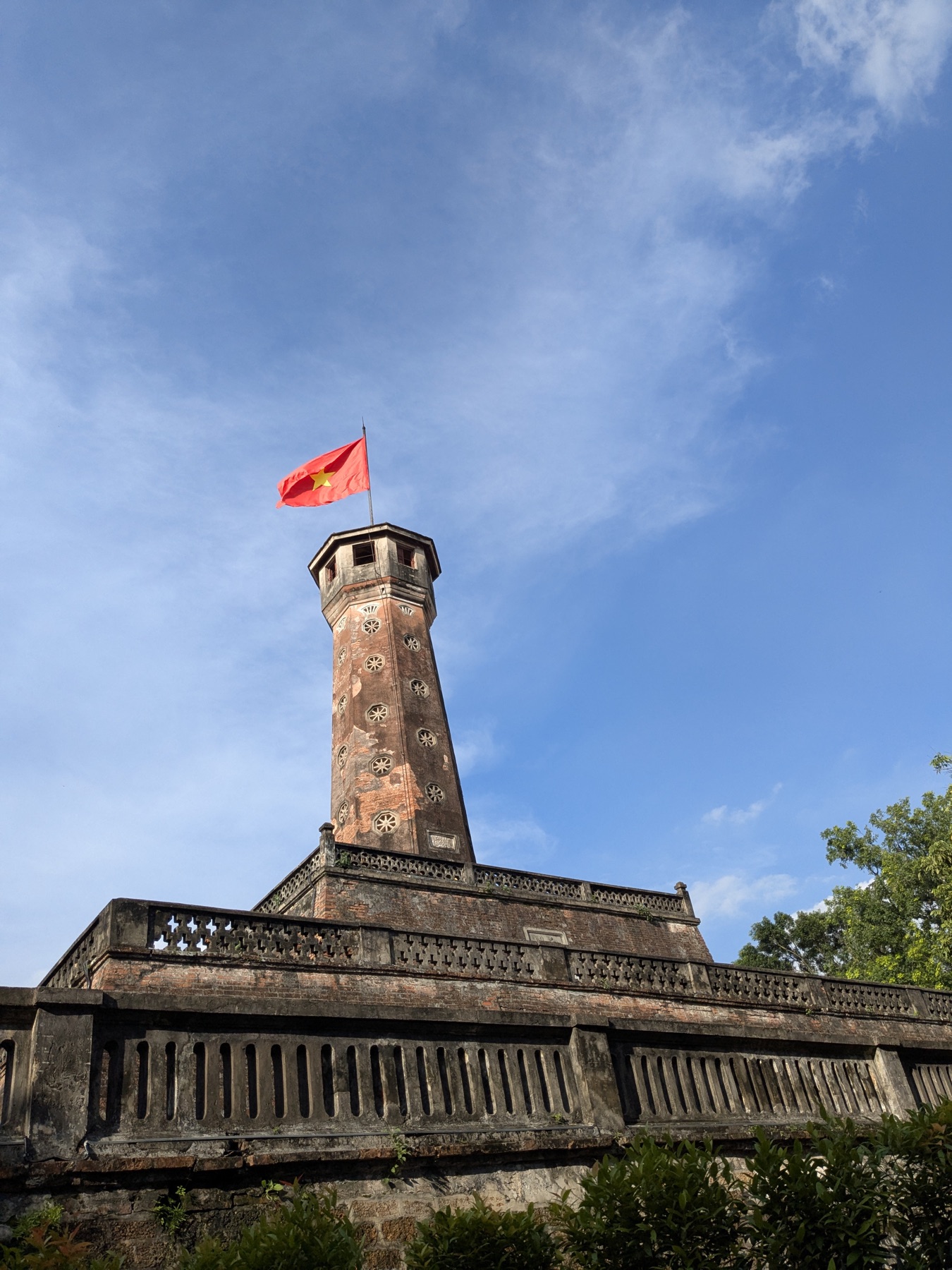 Vietnamese flag flying above the Flag Tower of Hanoi