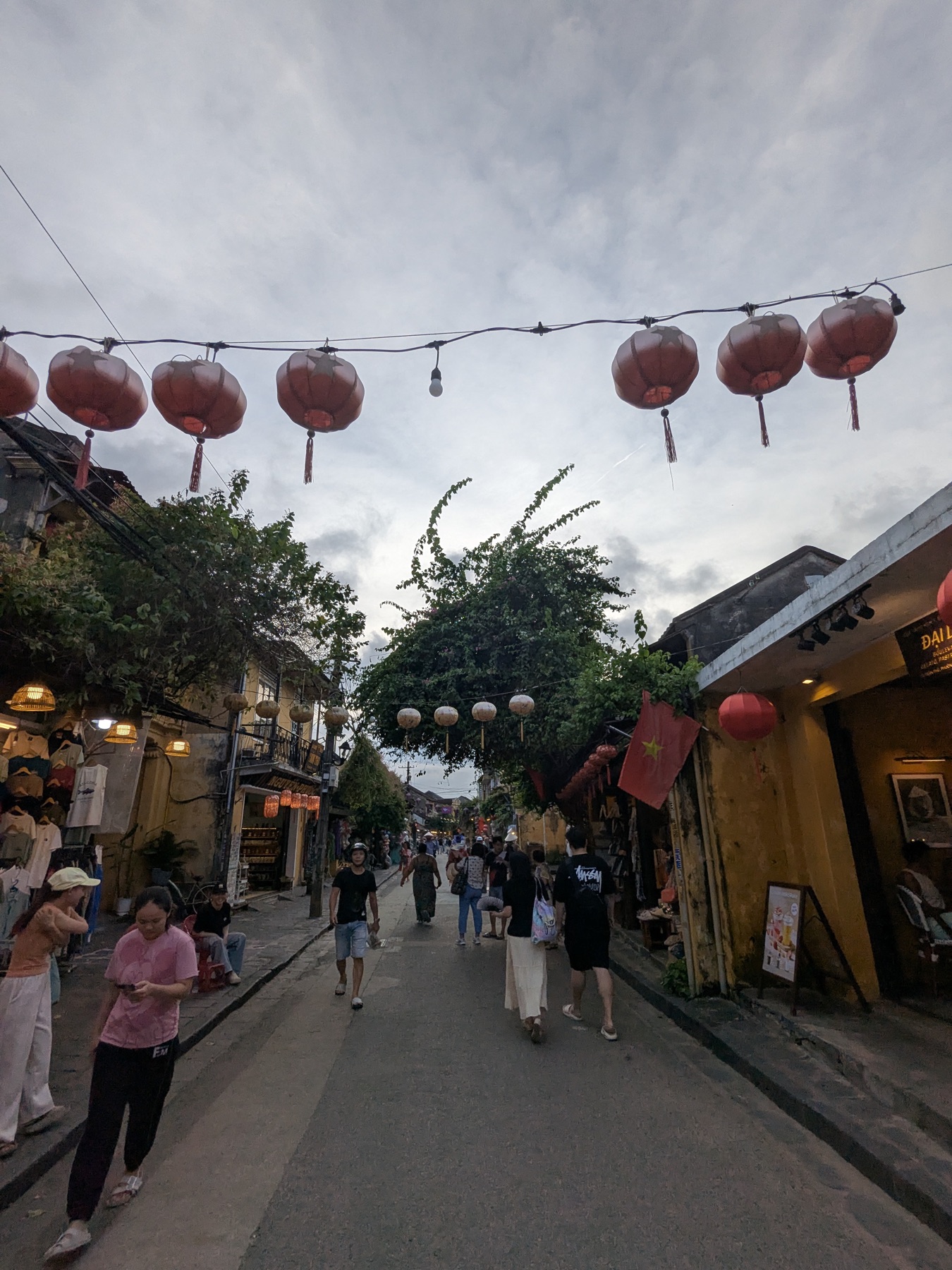 Lanterns hanging above a narrow street in Hoi An Ancient Town